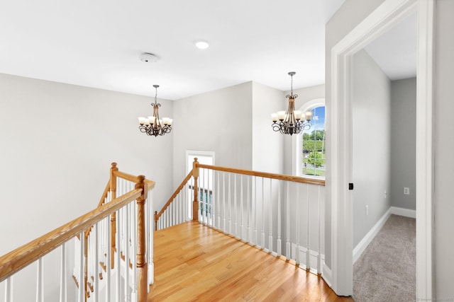 584 Meriden Ave Unit 1, Southington, CT 06489 - corridor with an upstairs landing, a chandelier, baseboards, and wood finished floors