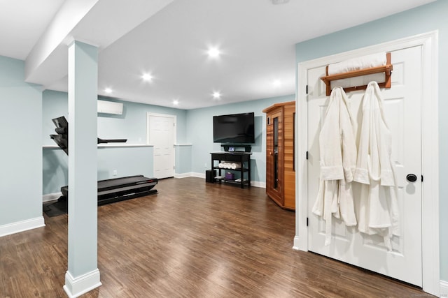 584 Meriden Ave Unit 1, Southington, CT 06489 - exercise area with wood finished floors, recessed lighting, an AC wall unit, and baseboards