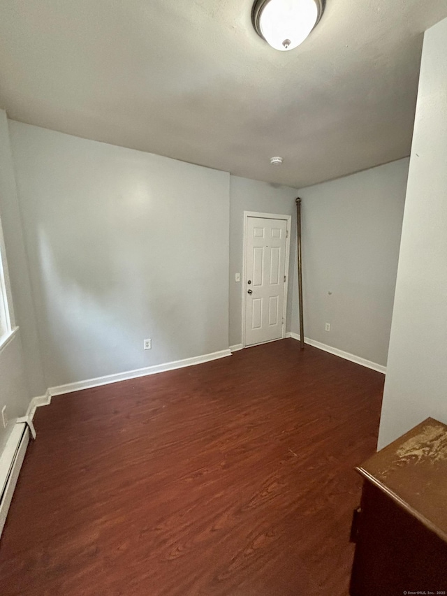 41 Lisbon St, Hartford, CT 06106 - empty room featuring baseboard heating, dark wood-style floors, and baseboards