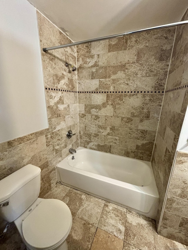 41 Lisbon St, Hartford, CT 06106 - full bathroom featuring bathing tub / shower combination, toilet, and tile walls