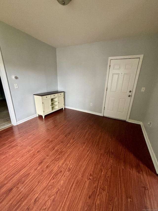 41 Lisbon St, Hartford, CT 06106 - empty room with dark wood-style floors and baseboards