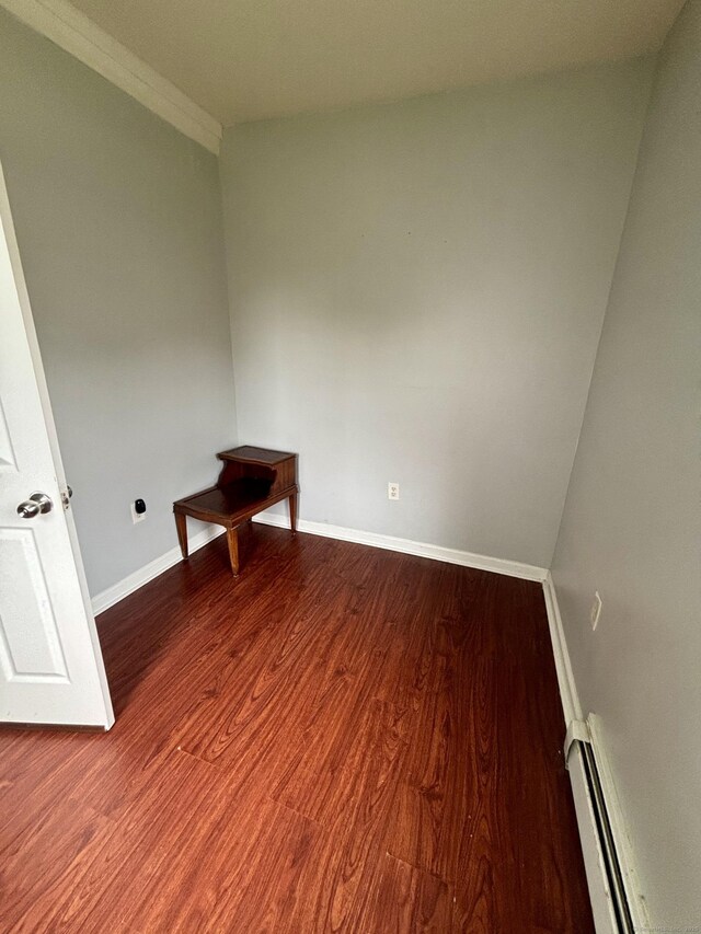 41 Lisbon St, Hartford, CT 06106 - unfurnished room featuring baseboard heating, baseboards, and wood finished floors