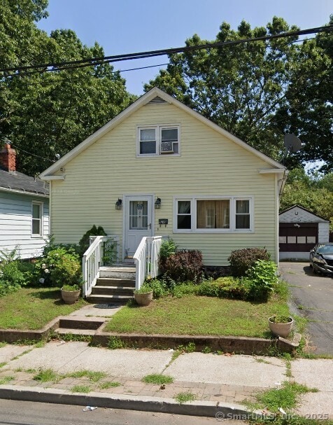 34 Orlando St, West Haven, CT 06516 - bungalow with a detached garage and an outbuilding