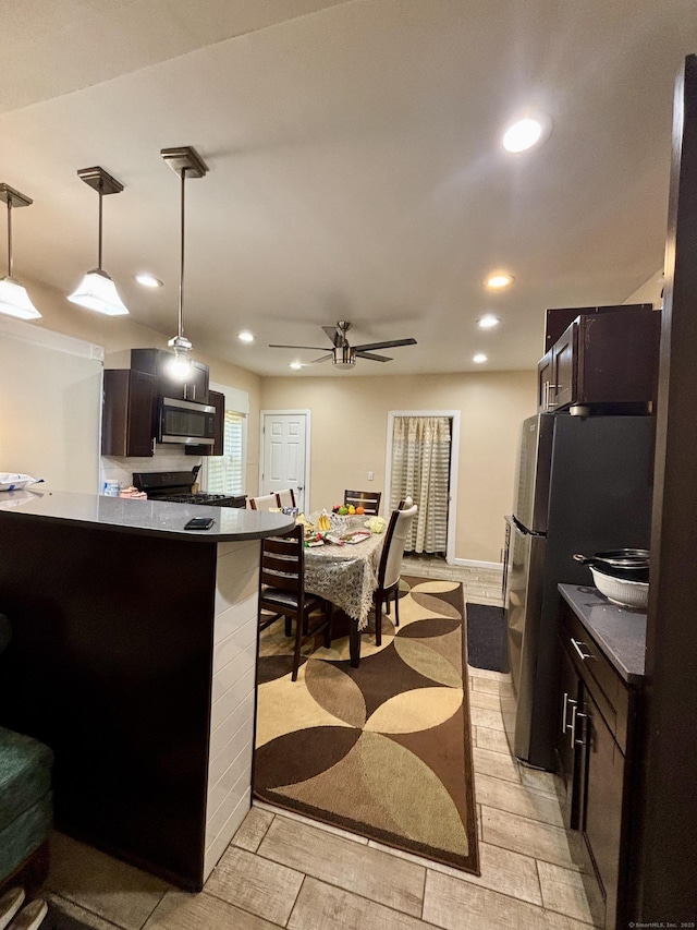 33 Wakefield Ct, New Britain, CT 06053 - kitchen with stainless steel microwave, recessed lighting, a ceiling fan, decorative light fixtures, and dark countertops