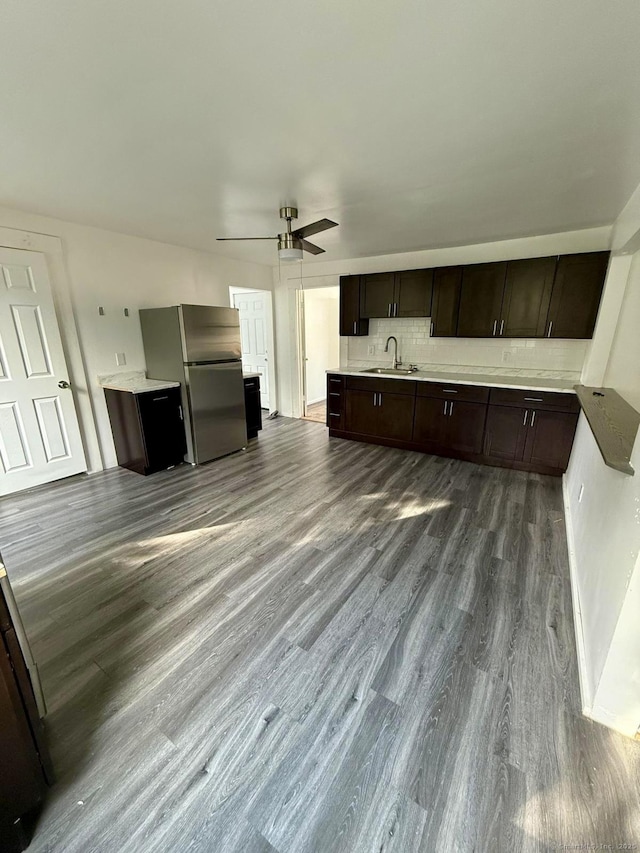 33 Wakefield Ct, New Britain, CT 06053 - kitchen with freestanding refrigerator, a sink, dark brown cabinets, dark wood finished floors, and ceiling fan