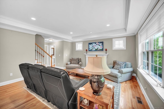 6 Mill Pond Ln Unit A, Simsbury, CT 06070 - living room with light wood-style flooring, a tray ceiling, crown molding, stairs, and baseboards