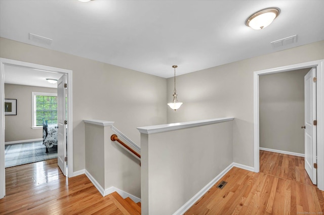 6 Mill Pond Ln Unit A, Simsbury, CT 06070 - hall featuring an upstairs landing, light wood-type flooring, and baseboards