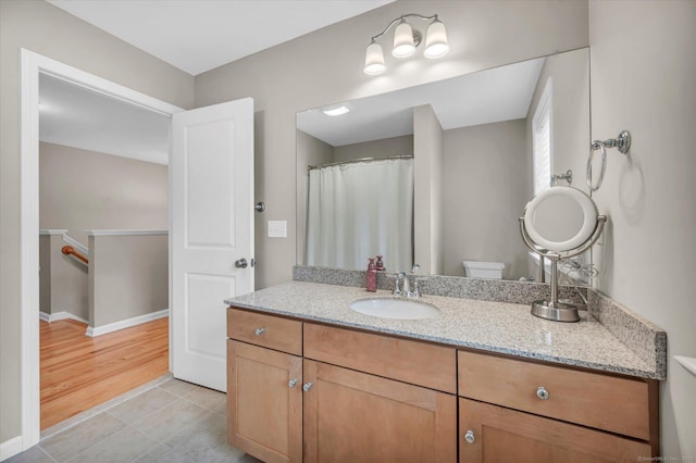 6 Mill Pond Ln Unit A, Simsbury, CT 06070 - full bathroom featuring tile patterned flooring, toilet, vanity, and baseboards
