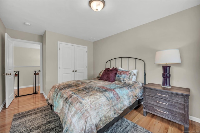 6 Mill Pond Ln Unit A, Simsbury, CT 06070 - bedroom with light wood finished floors, baseboards, and a closet