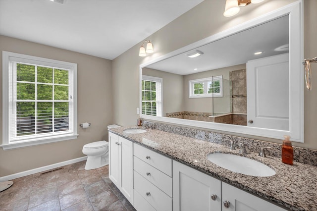 6 Mill Pond Ln Unit A, Simsbury, CT 06070 - full bathroom with plenty of natural light, baseboards, toilet, and walk in shower