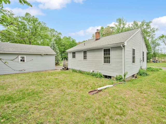 40 W View Dr, Enfield, CT 06082 - back of property featuring a chimney and a yard
