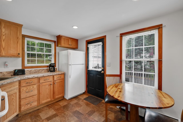 40 W View Dr, Enfield, CT 06082 - kitchen with freestanding refrigerator, stone finish flooring, and recessed lighting