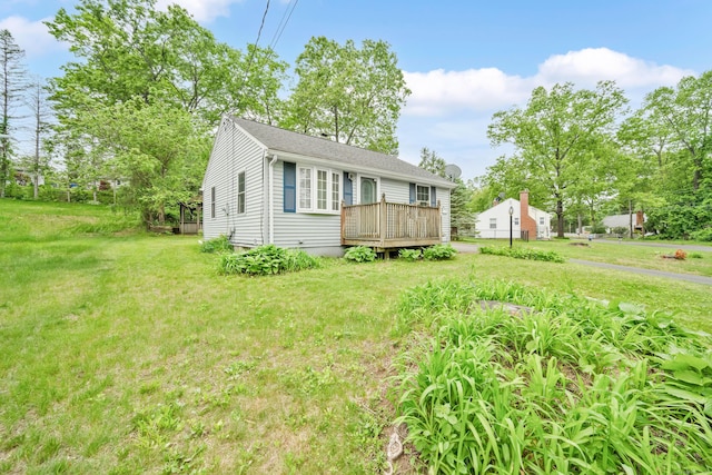 40 W View Dr, Enfield, CT 06082 - view of front of house featuring a deck, a front lawn, and roof with shingles