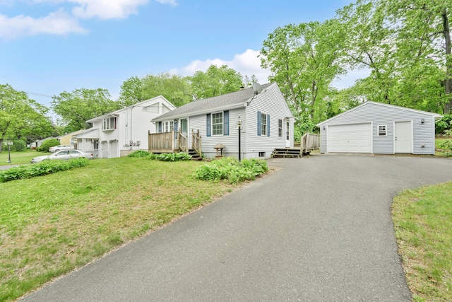 40 W View Dr, Enfield, CT 06082 - view of front facade with a garage, an outbuilding, a front yard, driveway, and a deck
