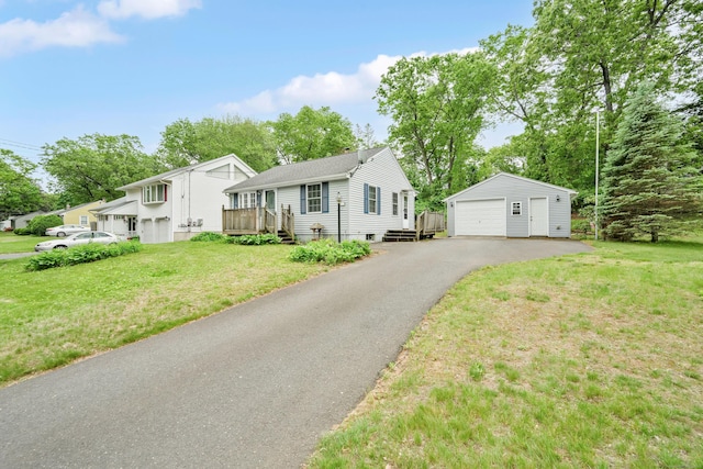 40 W View Dr, Enfield, CT 06082 - view of front facade with a detached garage, an outdoor structure, a front lawn, and a wooden deck