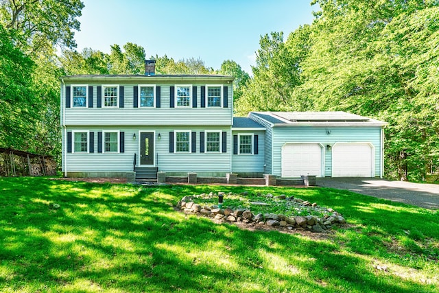 27 Porter Rd, Wolcott, CT 06716 - colonial home with a garage, driveway, a chimney, and entry steps