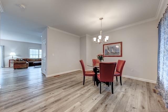 2 Linden Ct, Southington, CT 06489 - dining room with a chandelier, light wood finished floors, baseboards, and ornamental molding
