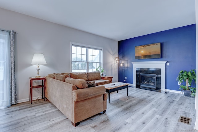 2 Linden Ct, Southington, CT 06489 - living room with wood finished floors, a glass covered fireplace, and baseboards