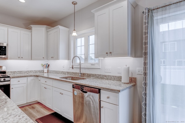 2 Linden Ct, Southington, CT 06489 - kitchen with stainless steel appliances, a sink, white cabinets, light wood-style flooring, and decorative light fixtures
