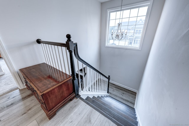 2 Linden Ct, Southington, CT 06489 - stairway with a chandelier, wood finished floors, and baseboards