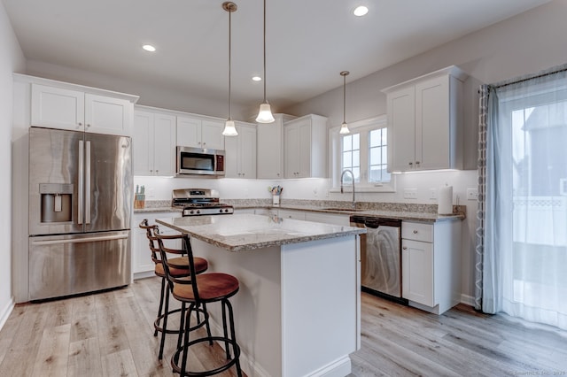 2 Linden Ct, Southington, CT 06489 - kitchen featuring stainless steel appliances, a sink, white cabinetry, light wood finished floors, and recessed lighting