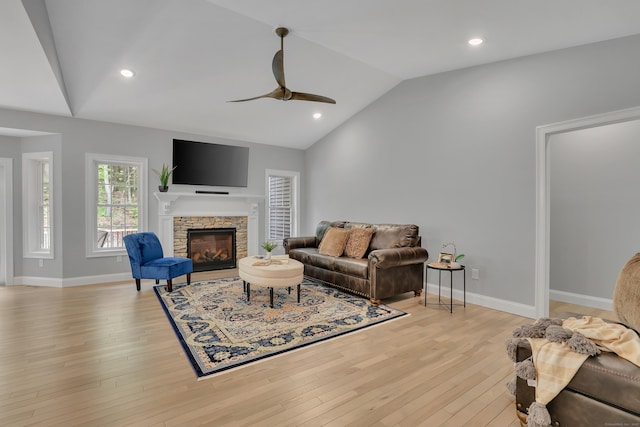 17 Paper Mill Rd, Marlborough, CT 06447 - living area featuring vaulted ceiling, ceiling fan, light wood-type flooring, a stone fireplace, and baseboards