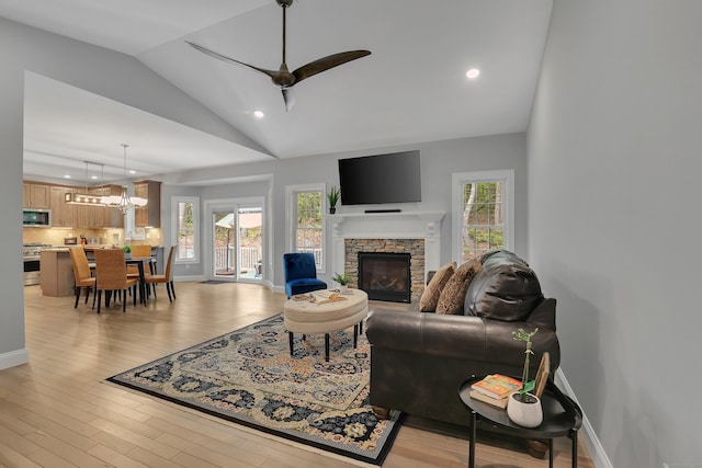 17 Paper Mill Rd, Marlborough, CT 06447 - living room featuring lofted ceiling, a fireplace, plenty of natural light, light wood-style floors, and recessed lighting