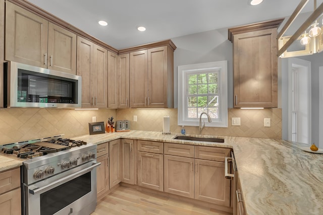 17 Paper Mill Rd, Marlborough, CT 06447 - kitchen with stainless steel appliances, a sink, light wood-style floors, light stone countertops, and recessed lighting