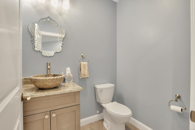 17 Paper Mill Rd, Marlborough, CT 06447 - half bathroom with baseboards, toilet, and vanity