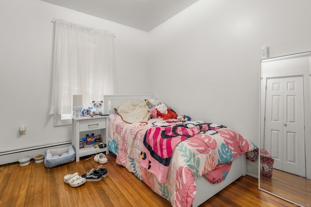 171 Frank St, New Haven, CT 06519 - bedroom featuring a baseboard radiator, hardwood / wood-style floors, and a closet