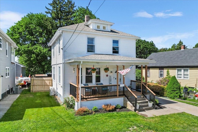 76 Geer Ave, Norwich, CT 06360 - traditional style home featuring covered porch, a front lawn, a chimney, and central AC