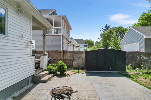 76 Geer Ave, Norwich, CT 06360 - fenced backyard featuring a patio area and a fire pit