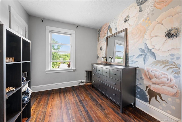 76 Geer Ave, Norwich, CT 06360 - bedroom featuring radiator heating unit, baseboards, dark wood-style floors, and a textured ceiling