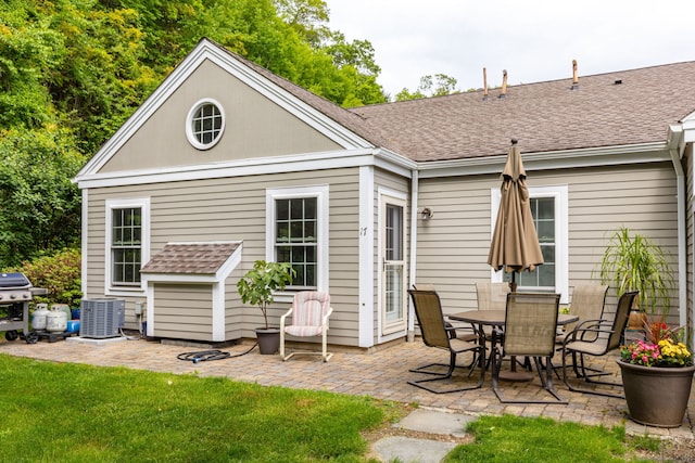 17 Saint George Pl Unit 17, Newtown, CT 06482 - back of house featuring a patio area, central AC unit, and a shingled roof