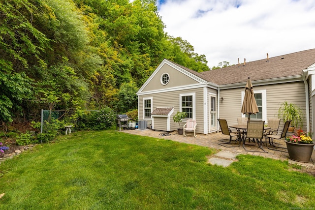 17 Saint George Pl Unit 17, Newtown, CT 06482 - back of house featuring a patio, a yard, and central AC