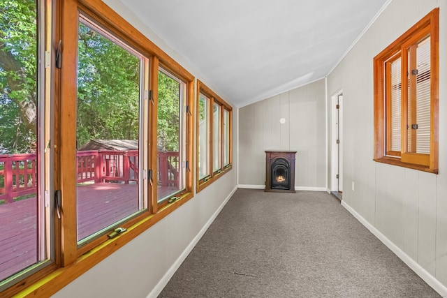 1975 Huntington Rd, Stratford, CT 06614 - unfurnished sunroom featuring carpet flooring, lofted ceiling, crown molding, and a wooden deck