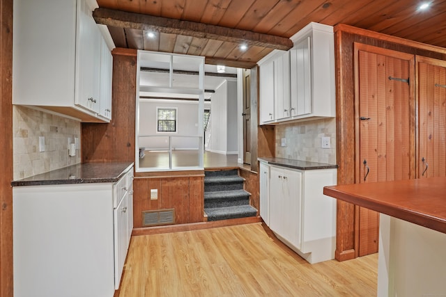 1975 Huntington Rd, Stratford, CT 06614 - kitchen featuring wood ceiling, light wood-style floors, tasteful backsplash, white cabinets, and recessed lighting
