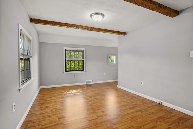 1975 Huntington Rd, Stratford, CT 06614 - spare room with beamed ceiling and light wood-style flooring