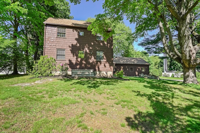 1975 Huntington Rd, Stratford, CT 06614 - rear view of house featuring a lawn