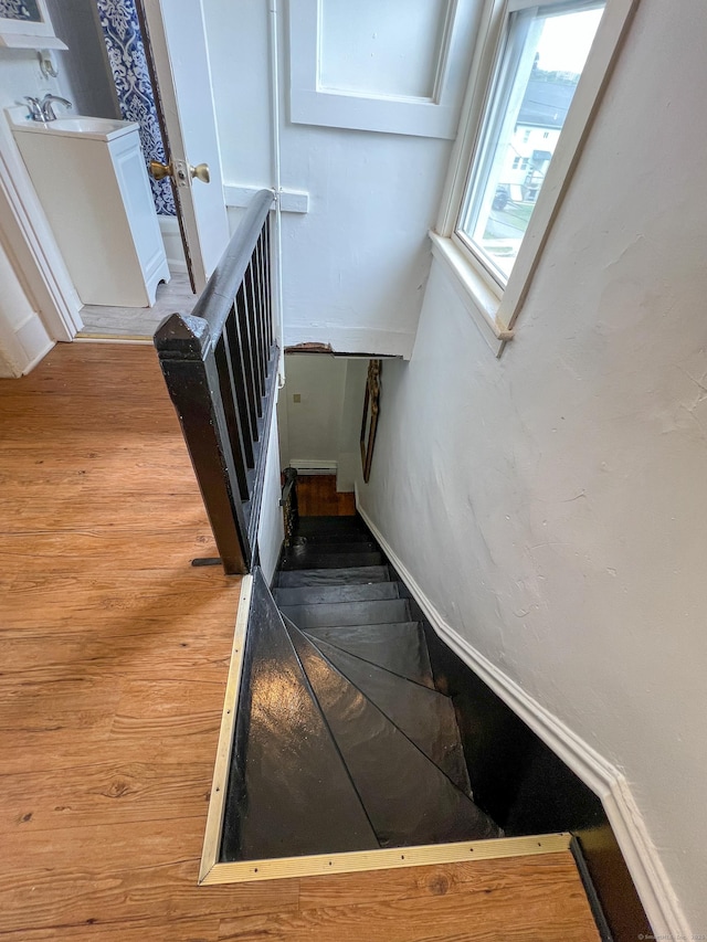 24 Willetts Ave, New London, CT 06320 - stairway featuring wood finished floors and baseboards