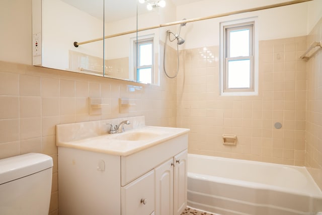 70 Grove Hill St Apt 3R, New Britain, CT 06052 - bathroom featuring tile walls, shower / bath combination, vanity, and toilet