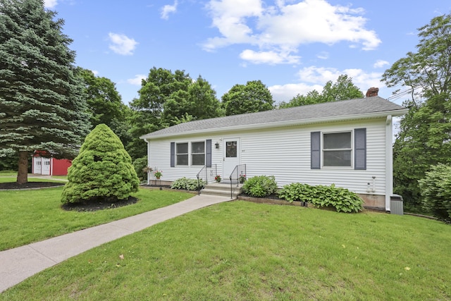63 Bidwell St, Middletown, CT 06457 - view of front of property with a chimney and a front yard
