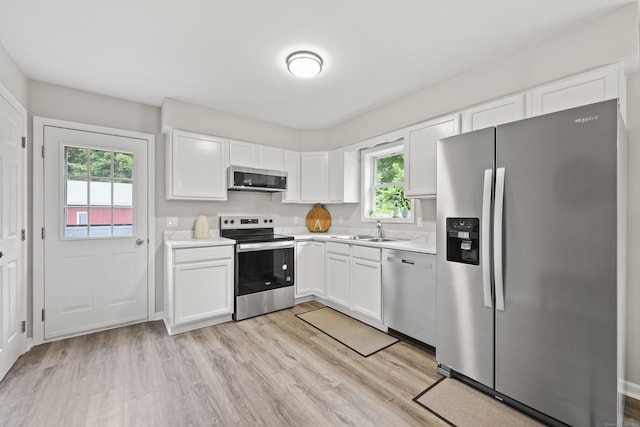 63 Bidwell St, Middletown, CT 06457 - kitchen featuring appliances with stainless steel finishes, a sink, light countertops, and plenty of natural light