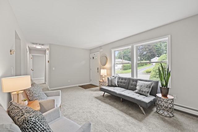 63 Bidwell St, Middletown, CT 06457 - carpeted living room featuring a baseboard heating unit and baseboards
