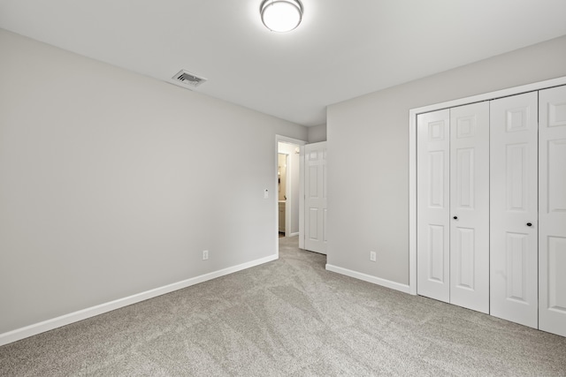 63 Bidwell St, Middletown, CT 06457 - unfurnished bedroom featuring carpet floors, baseboards, and a closet