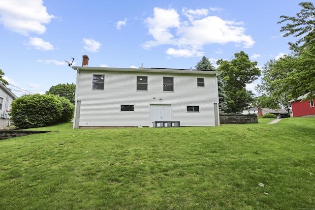 63 Bidwell St, Middletown, CT 06457 - rear view of house featuring a chimney and a yard