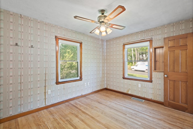 41 Beaver Brook Rd, Danbury, CT 06810 - spare room with wood finished floors, baseboards, wallpapered walls, and ceiling fan