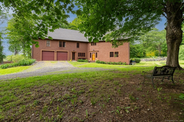 96 Middle Haddam Rd, East Hampton, CT 06456 - view of front of property featuring a garage, a front yard, and gravel driveway