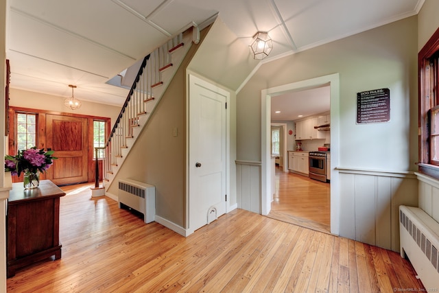 96 Middle Haddam Rd, East Hampton, CT 06456 - foyer entrance with radiator, light wood-style floors, stairway, wainscoting, and ornamental molding