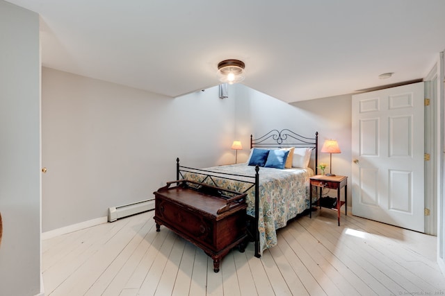 96 Middle Haddam Rd, East Hampton, CT 06456 - bedroom featuring baseboard heating, wood finished floors, and baseboards